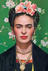 There was a feminist that resided within me. Image of Fridda Kahlo against green backdrop with pin flowers.